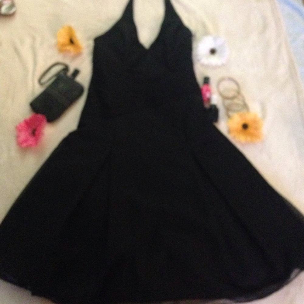 Gorgeous black halter dress. Runs small.